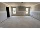 Large unfinished room featuring drywall and bright, natural light from two windows at 18 W Emily Gardens Dr, Selma, NC 27577