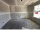 Unfinished room displaying drywall and a bright window at 18 W Emily Gardens Dr, Selma, NC 27577