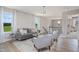 Comfortable living room with a gray sofa, two side chairs, modern decor and hardwood floors at 2011 Cross Bones Blvd # 41, Durham, NC 27703