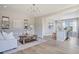 Open concept living room with modern decor, wood floors and plenty of natural light near an eat-in kitchen area at 2011 Cross Bones Blvd # 41, Durham, NC 27703