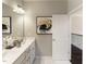 Modern bathroom featuring a double vanity, framed mirror and a walk-in shower at 205 E Fountainhead Ln # 159, Garner, NC 27529