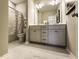 Bathroom with vanity, large mirror, marble floors, and a walk-in shower at 205 E Fountainhead Ln # 159, Garner, NC 27529