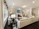 Cozy living room with a fireplace, comfortable seating, and stylish decor at 205 E Fountainhead Ln # 159, Garner, NC 27529