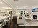 Bright, open living room with hardwood floors, a fireplace, and large windows at 205 E Fountainhead Ln # 159, Garner, NC 27529