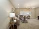 Comfortable living room with plush seating, side tables, and modern decor at 205 E Fountainhead Ln # 159, Garner, NC 27529