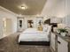 Serene main bedroom featuring a tray ceiling, stylish decor, and plenty of natural light at 205 E Fountainhead Ln # 159, Garner, NC 27529