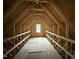 Unfinished attic space showing the roof truss construction at 21 Trescott St, Smithfield, NC 27577
