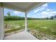 View of spacious backyard featuring open green space and partial fencing at 21 Trescott St, Smithfield, NC 27577