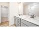 Bathroom with double sink vanity, modern fixtures, and a glass-enclosed shower at 21 Trescott St, Smithfield, NC 27577
