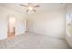 Spacious bedroom with neutral carpet, ample natural light, and an en-suite bathroom at 21 Trescott St, Smithfield, NC 27577