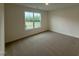 Bedroom featuring neutral carpet, crisp white trim and a large window at 21 Trescott St, Smithfield, NC 27577