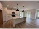 Bright kitchen with a large island, granite countertops, stainless appliances, and ample cabinet space at 21 Trescott St, Smithfield, NC 27577
