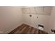 Functional laundry room with shelving and hookups for washer and dryer at 21 Trescott St, Smithfield, NC 27577