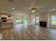 Open concept living room and kitchen with granite countertops and a fireplace at 21 Trescott St, Smithfield, NC 27577