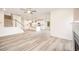 Open-concept living area showcasing a modern fireplace and seamlessly connected kitchen at 21 Trescott St, Smithfield, NC 27577