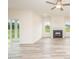 Bright living room with fireplace, ample natural light, and access to the outdoor patio at 21 Trescott St, Smithfield, NC 27577