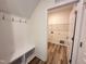 Convenient mudroom with built-in bench and hooks, leading to a laundry area at 21 Trescott St, Smithfield, NC 27577