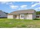 An open backyard with a covered patio offering serene outdoor living at 210 Maxwell Farm Ln, Selma, NC 27576