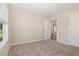 Neutral bedroom with large window, carpet and adjoining bathroom at 210 Maxwell Farm Ln, Selma, NC 27576