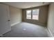 Cozy bedroom with a large window, offering plenty of natural light, ready to be personalized as a comfortable living space at 210 Maxwell Farm Ln, Selma, NC 27576
