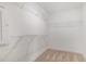 Walk-in closet with wire shelving and neutral carpet at 210 Maxwell Farm Ln, Selma, NC 27576