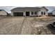 Charming single-story home featuring a two-car garage and stone accents, set in a new development neighborhood at 210 Maxwell Farm Ln, Selma, NC 27576