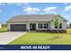 Charming single-story home with a well-manicured lawn, attached garage and appealing neutral color palette at 210 Maxwell Farm Ln, Selma, NC 27576