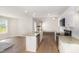 Modern kitchen boasts stainless steel appliances, granite countertops, an island, and seamless flow to living area at 210 Maxwell Farm Ln, Selma, NC 27576