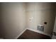 Convenient laundry room includes a shelf, washer hookups and modern flooring at 210 Maxwell Farm Ln, Selma, NC 27576