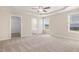 Spacious main bedroom features a ceiling fan, carpet, and an ensuite bath at 210 Maxwell Farm Ln, Selma, NC 27576