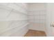 Spacious walk-in pantry with ample shelving and a well-organized design for convenient storage of groceries and essentials at 210 Maxwell Farm Ln, Selma, NC 27576