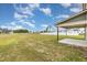 Spacious backyard featuring a green lawn and view of a patio on a sunny day at 212 Tuscany Cir, Princeton, NC 27569
