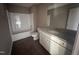 Clean bathroom features tub shower, modern vanity with granite counter, and white finishes at 212 Tuscany Cir, Princeton, NC 27569