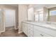 Bathroom featuring double sinks, granite countertop, and a shower stall at 212 Tuscany Cir, Princeton, NC 27569