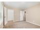 Bedroom with carpet, doors to closet and bathroom, and neutral walls at 212 Tuscany Cir, Princeton, NC 27569