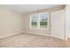 Bedroom with carpet, two windows with blinds, and a closet at 212 Tuscany Cir, Princeton, NC 27569