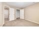 Bedroom with carpet and doors to closet, bathroom, and hallway at 212 Tuscany Cir, Princeton, NC 27569