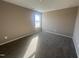 Simple bedroom featuring plush carpet, natural light, and neutral walls, ideal for a guest room at 212 Tuscany Cir, Princeton, NC 27569