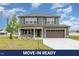Two-story home showcasing its siding, a two-car garage, and a well-manicured front lawn at 212 Tuscany Cir, Princeton, NC 27569