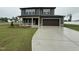 Charming two-story home with attached garage and a well-manicured lawn at 212 Tuscany Cir, Princeton, NC 27569