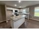 Bright kitchen features granite counters, a center island, and stainless steel appliances at 212 Tuscany Cir, Princeton, NC 27569