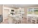 Bright kitchen featuring granite countertops, stainless steel appliances, and a center island with seating at 212 Tuscany Cir, Princeton, NC 27569