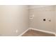Laundry room with overhead shelving and washer/dryer connections at 212 Tuscany Cir, Princeton, NC 27569