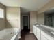 Primary bath with double vanity, soaking tub and walk-in shower at 212 Tuscany Cir, Princeton, NC 27569