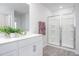 Clean bathroom features a modern vanity, sink, and glass-enclosed shower at 2153 Monk Dr, Haw River, NC 27258