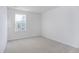 Light-filled bedroom with soft carpet, window view, and neutral paint at 2153 Monk Dr, Haw River, NC 27258