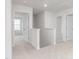Upstairs hallway offers great natural light and easy access to rooms at 2153 Monk Dr, Haw River, NC 27258