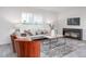 Inviting living room features a comfortable sofa, accent chairs, a large window, and stylish decor at 2153 Monk Dr, Haw River, NC 27258