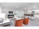 Bright, open living room flows into kitchen with bar seating and modern finishes at 2153 Monk Dr, Haw River, NC 27258
