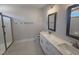 Bathroom featuring double sink vanity, framed mirrors, separate shower and modern fixtures at 221 Tee Dr, Selma, NC 27576